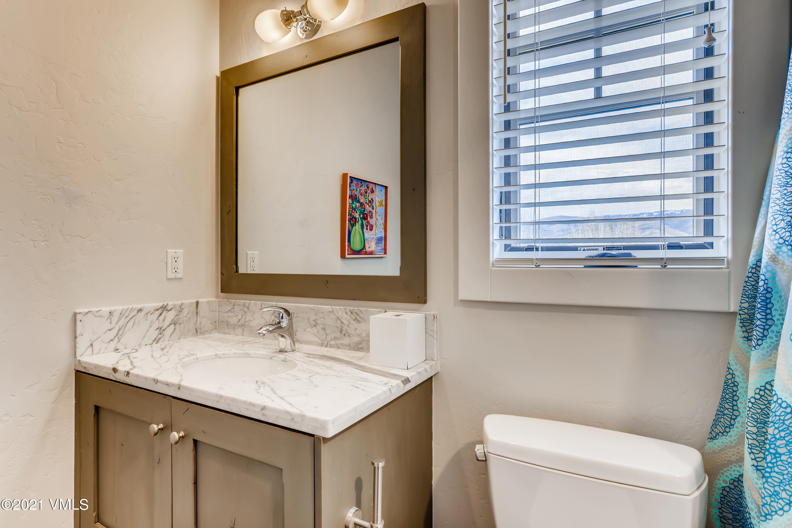 204 Remington Trail Edwards, CO 81632 - Photo 19 of 30 a bathroom with a granite countertop sink and a toilet