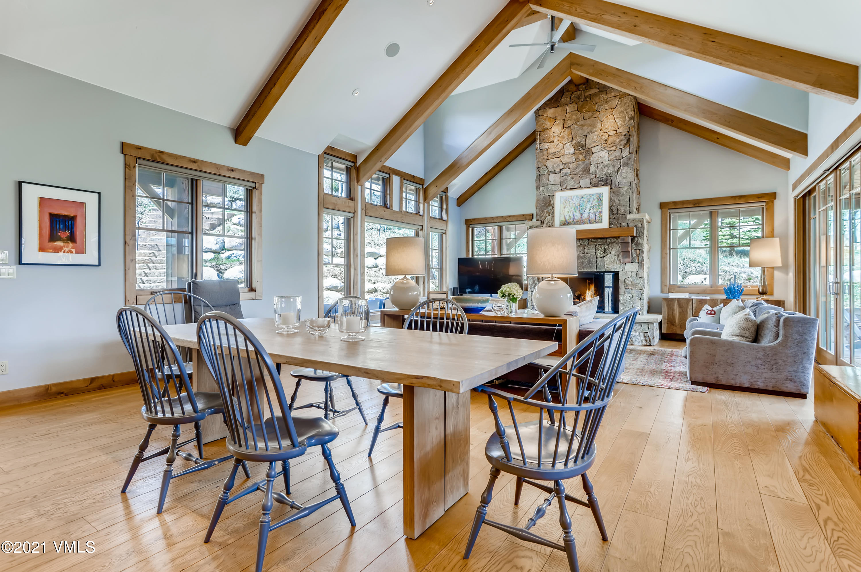 204 Remington Trail Edwards, CO 81632 - Photo 6 of 30 a view of a dining room and livingroom with furniture a rug a potted plant and a chandelier