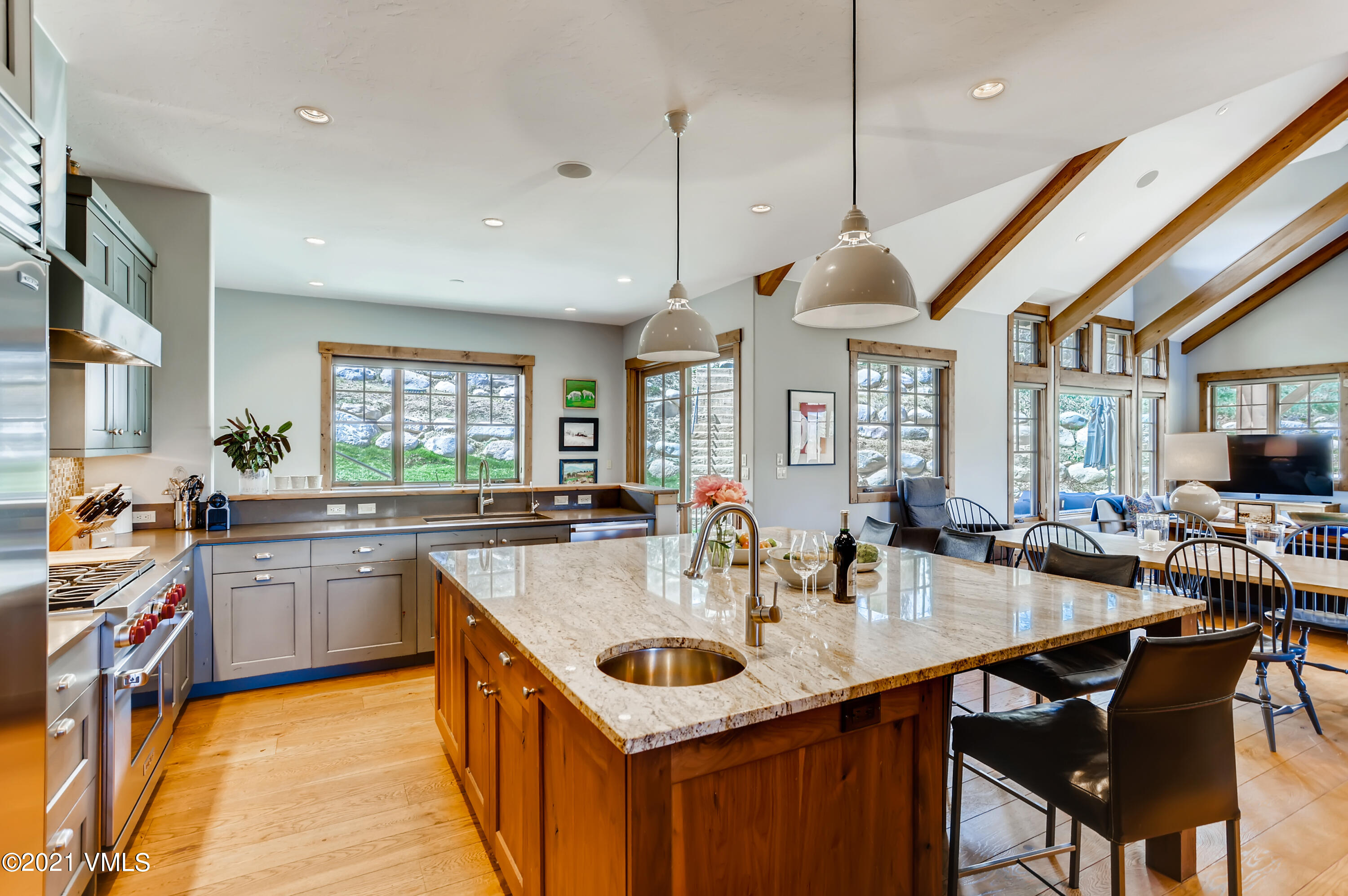 204 Remington Trail Edwards, CO 81632 - Photo 9 of 30 a kitchen with kitchen island a sink dining table and chairs