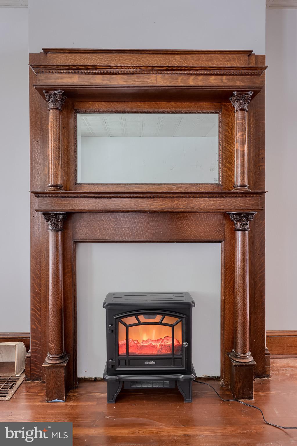 720 1st Street Lancaster, PA 17603 - Photo 13 of 50 a living room with a fireplace and a flat screen tv