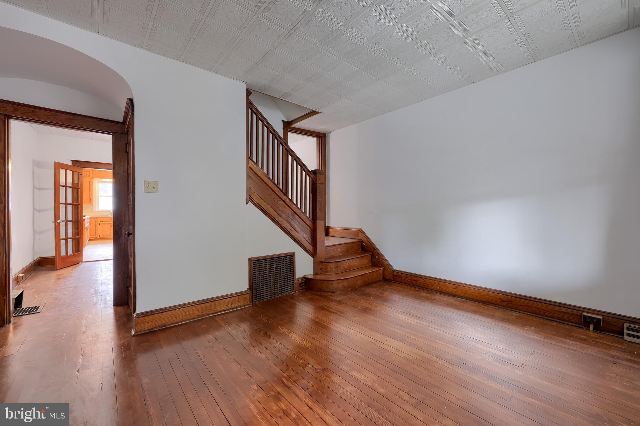 720 1st Street Lancaster, PA 17603 - Photo 19 of 50 a view of an empty room with wooden floor and a window