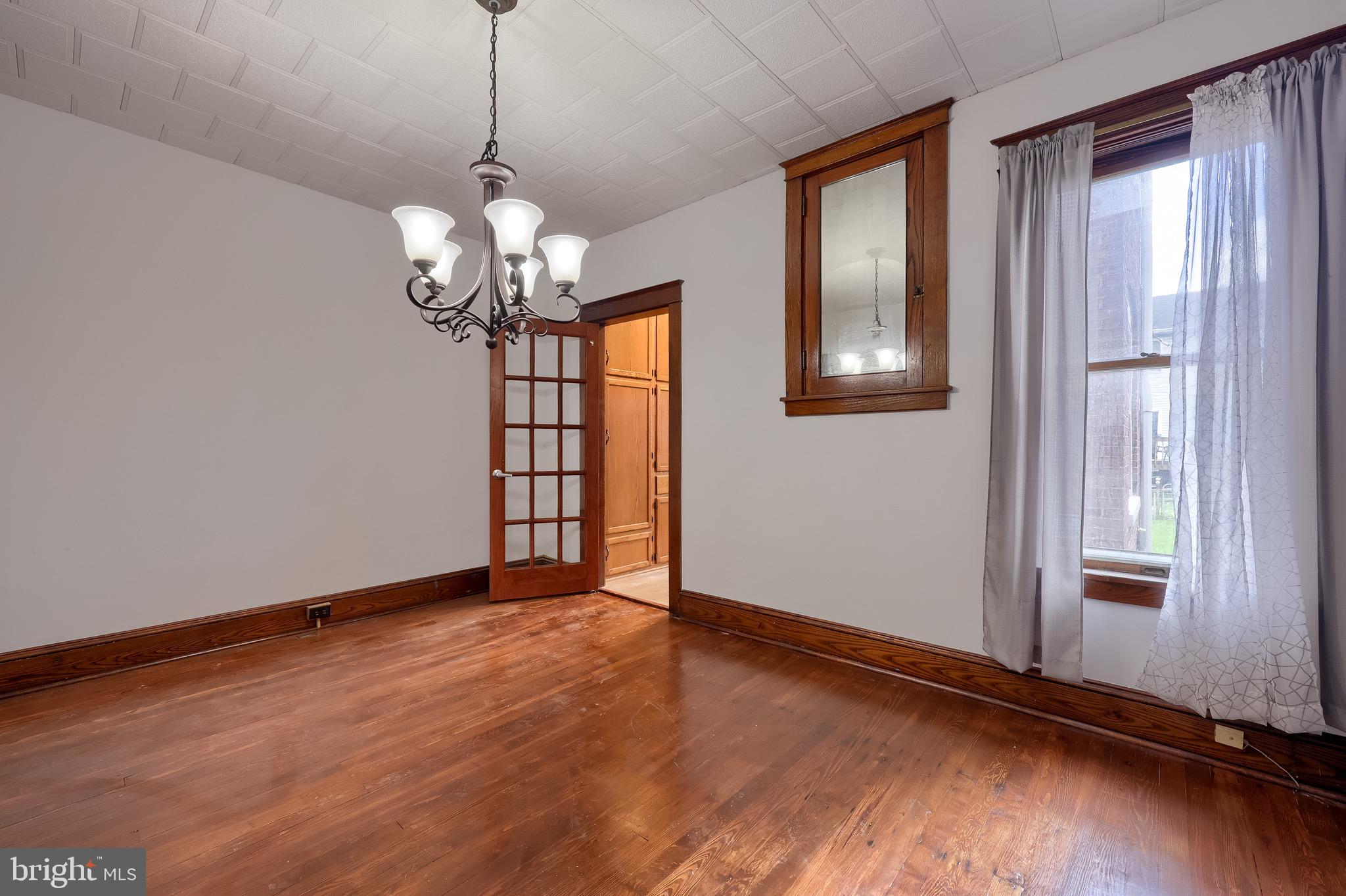 720 1st Street Lancaster, PA 17603 - Photo 23 of 50 a view of a room with wooden floor chandelier and windows