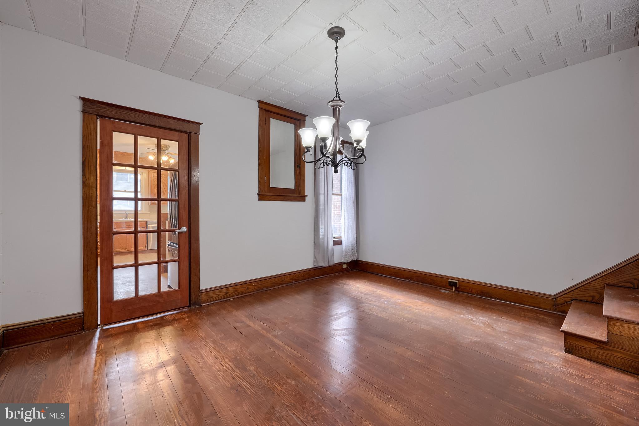 720 1st Street Lancaster, PA 17603 - Photo 25 of 50 a view of an empty room with wooden floor and a window