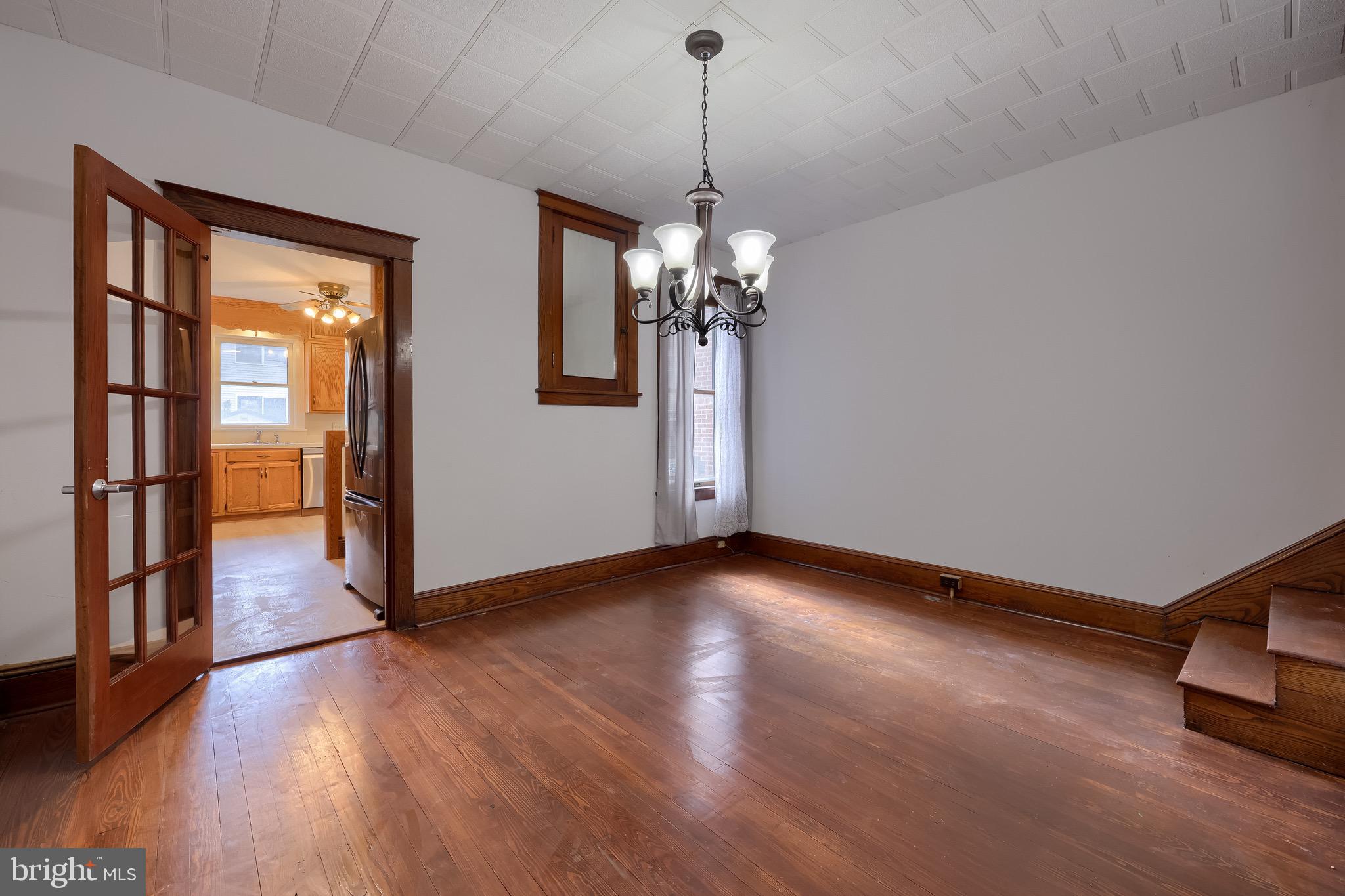 720 1st Street Lancaster, PA 17603 - Photo 26 of 50 a view of a livingroom with wooden floor and a chandelier