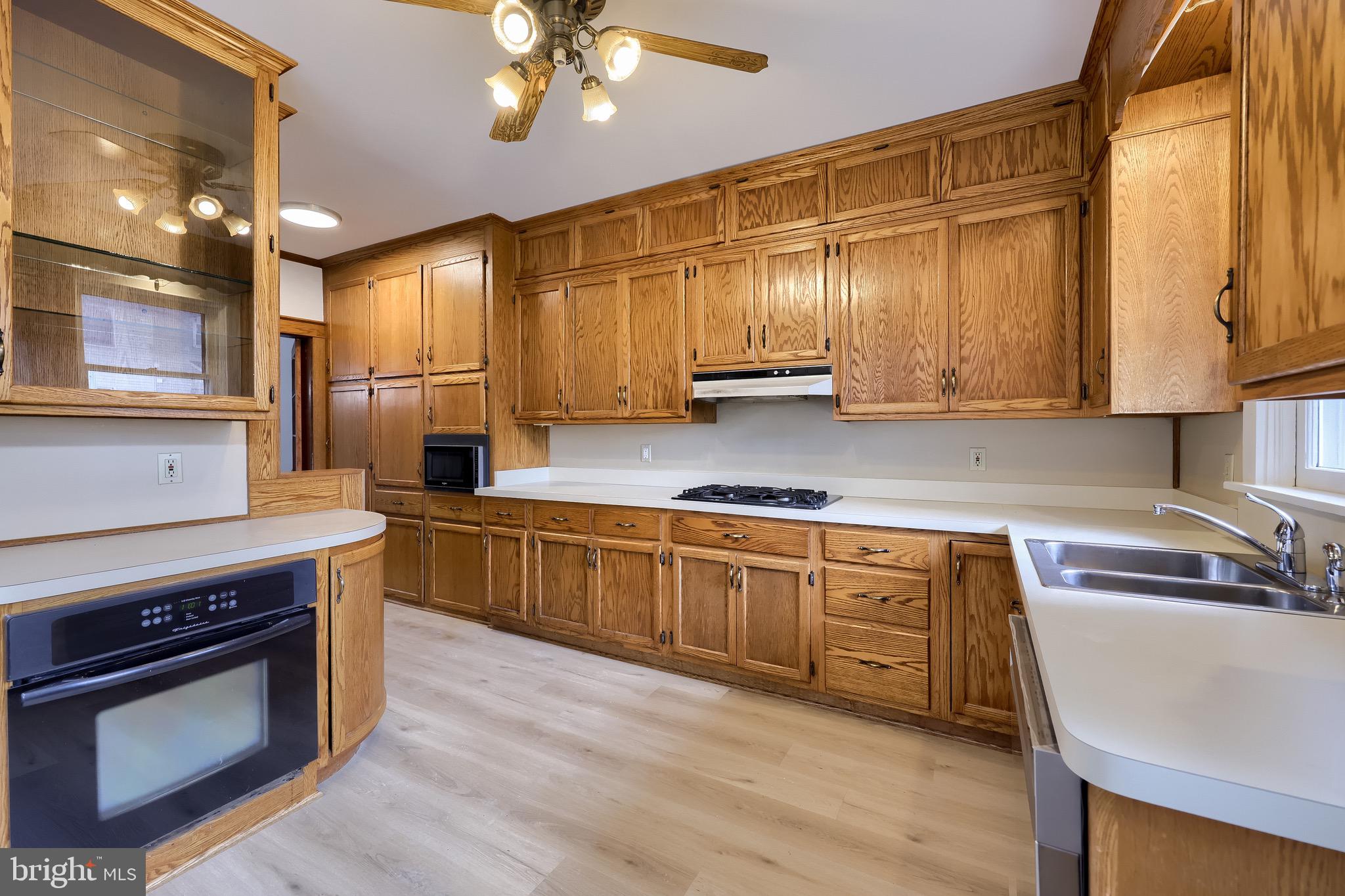 720 1st Street Lancaster, PA 17603 - Photo 28 of 50 a kitchen with stainless steel appliances sink a stove and cabinets