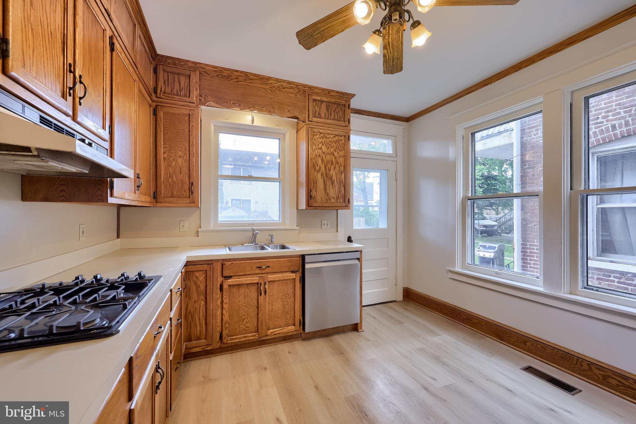 720 1st Street Lancaster, PA 17603 - Photo 30 of 50 a kitchen with a stove a sink and a refrigerator