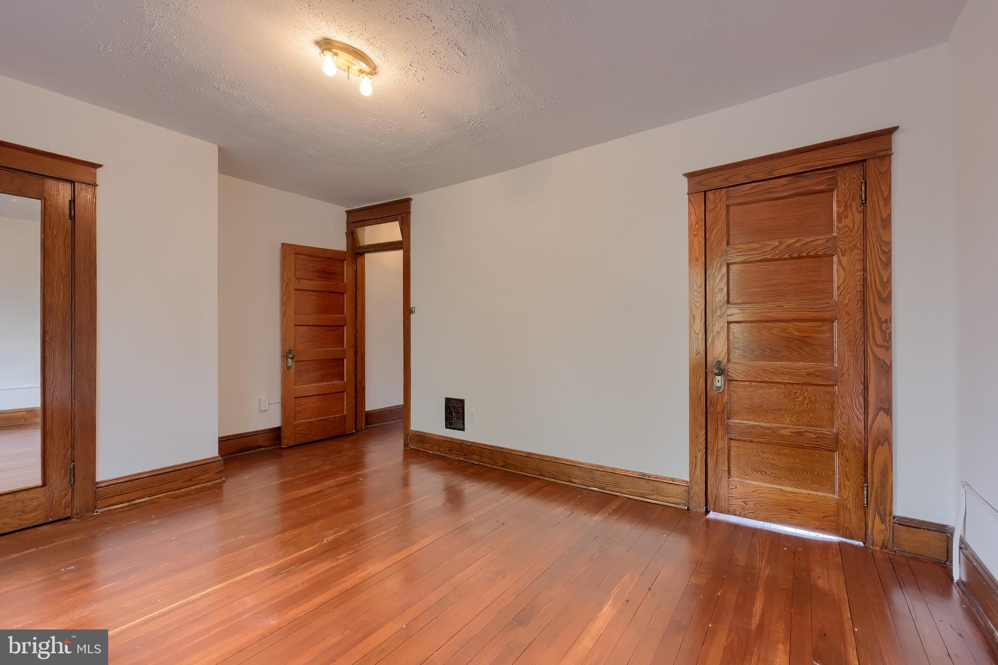 720 1st Street Lancaster, PA 17603 - Photo 34 of 50 an empty room with wooden floor & closet area