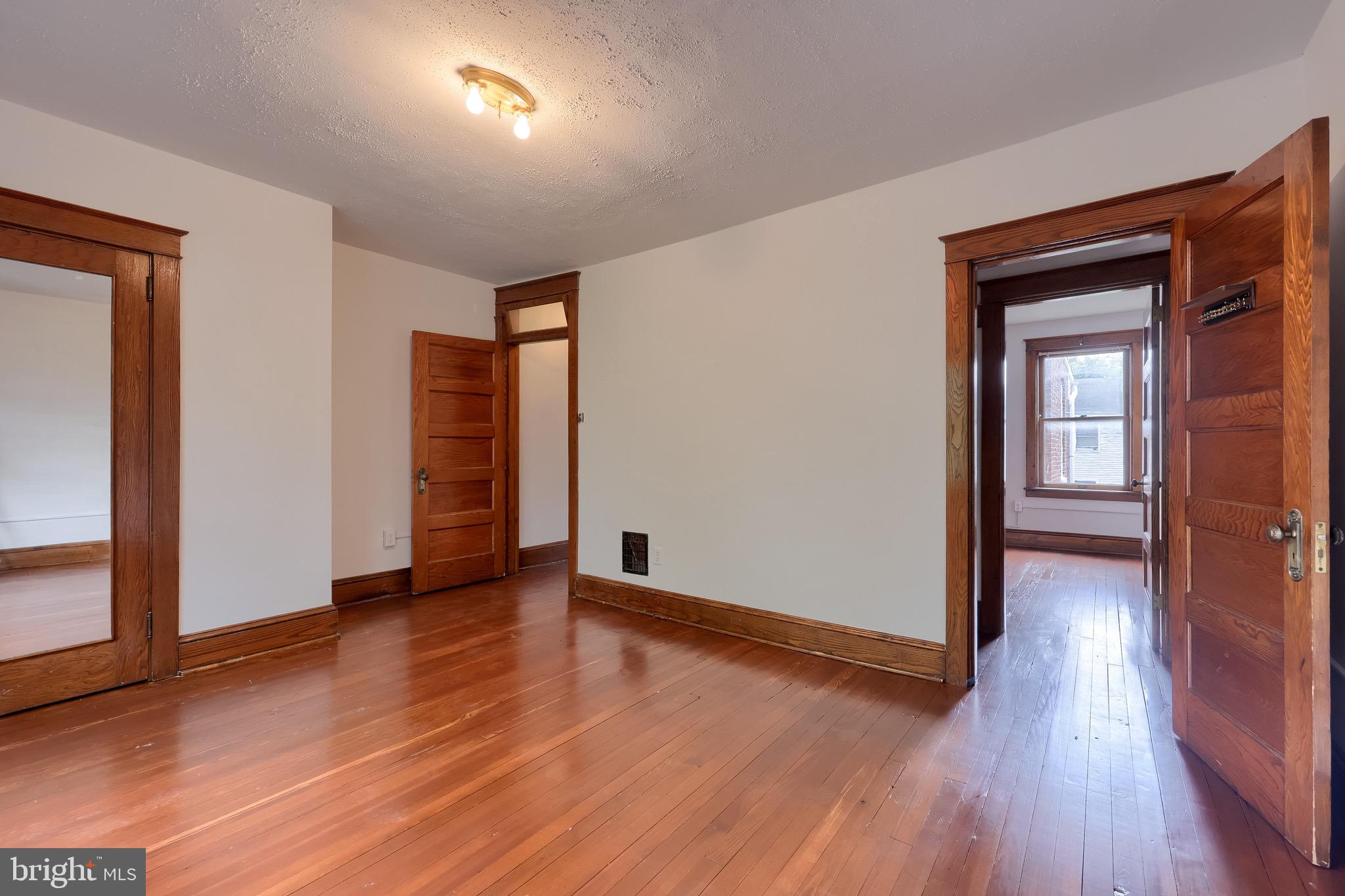 720 1st Street Lancaster, PA 17603 - Photo 35 of 50 wooden floor in an empty room with a window