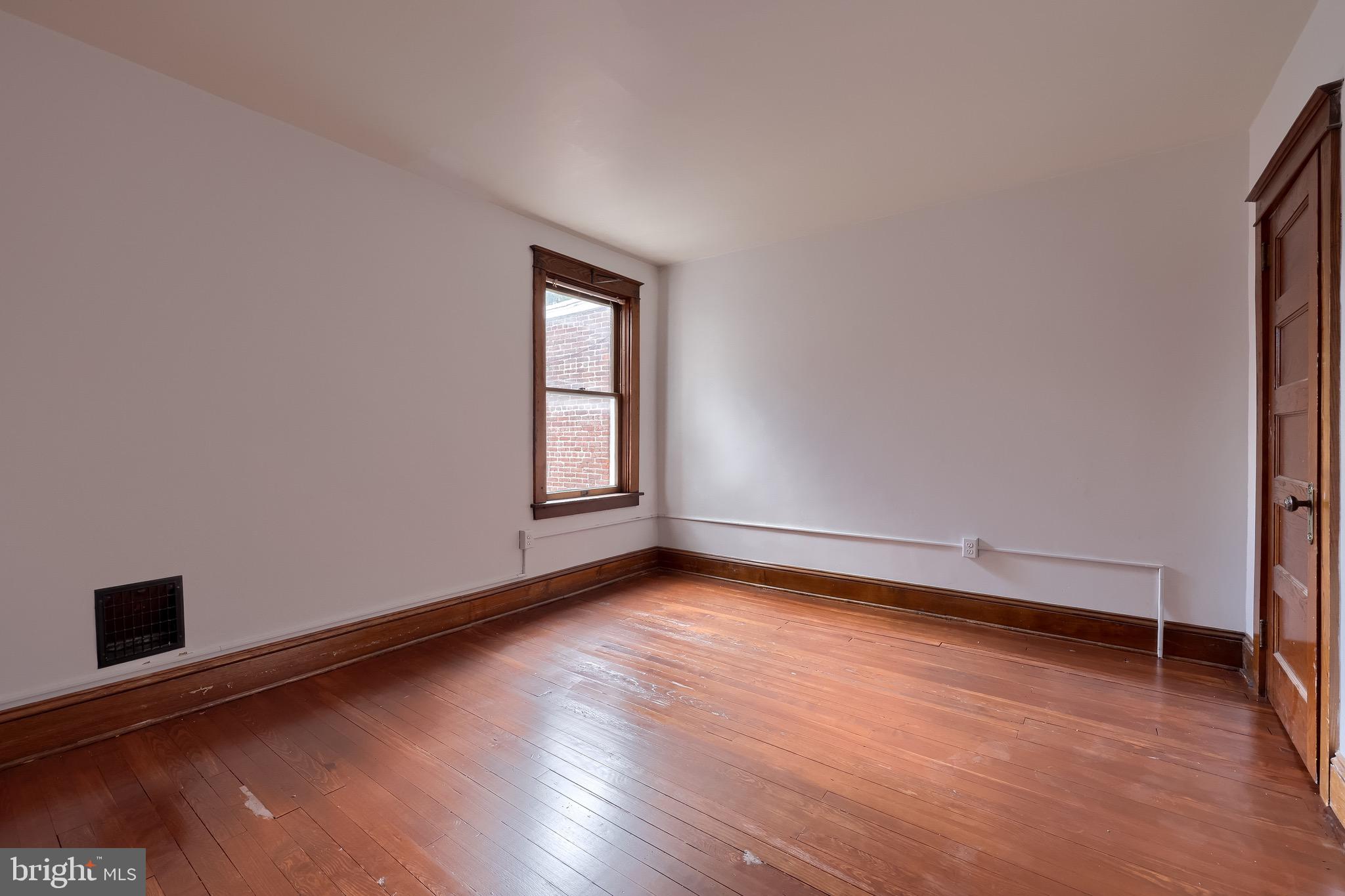 720 1st Street Lancaster, PA 17603 - Photo 39 of 50 an empty room with wooden floor and windows
