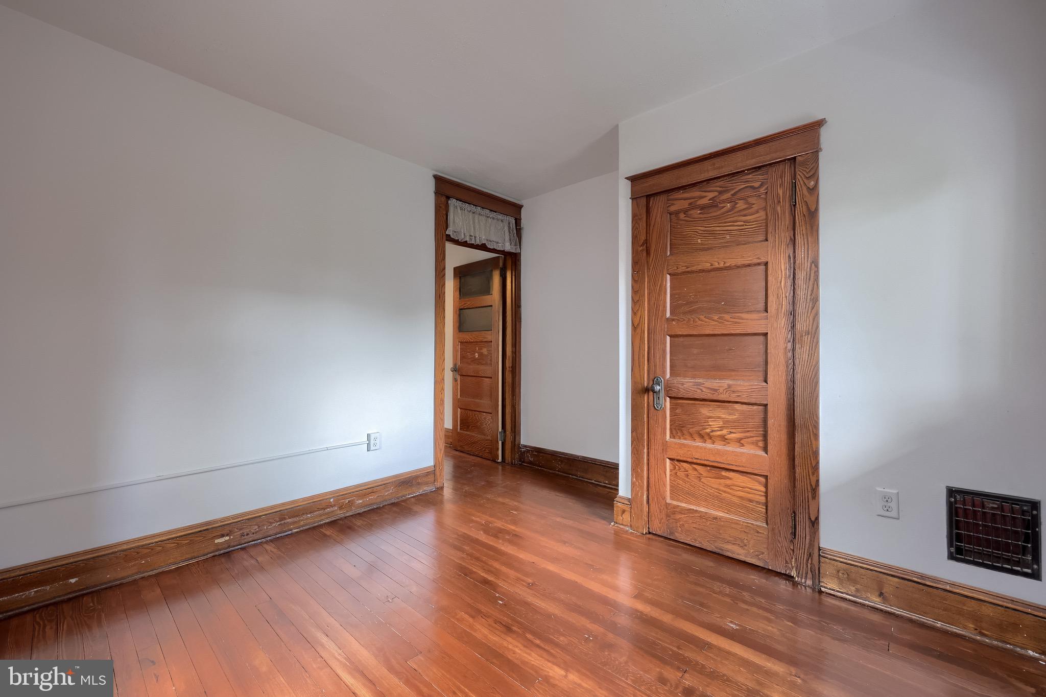 720 1st Street Lancaster, PA 17603 - Photo 43 of 50 an empty room with wooden floor closet and windows