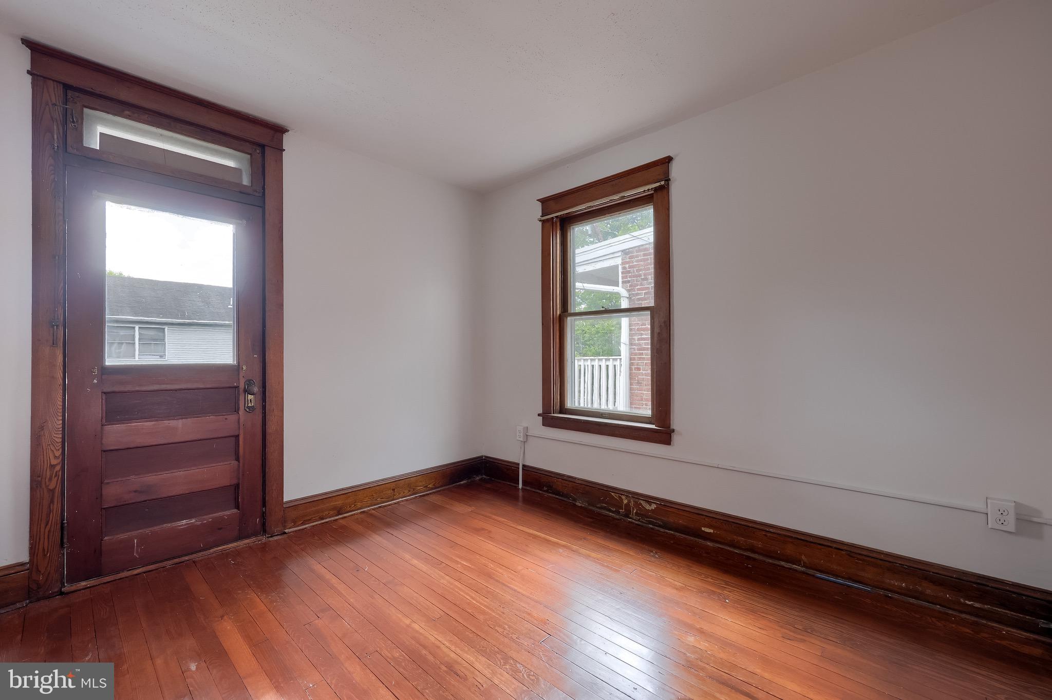 720 1st Street Lancaster, PA 17603 - Photo 44 of 50 an empty room with wooden floor and windows