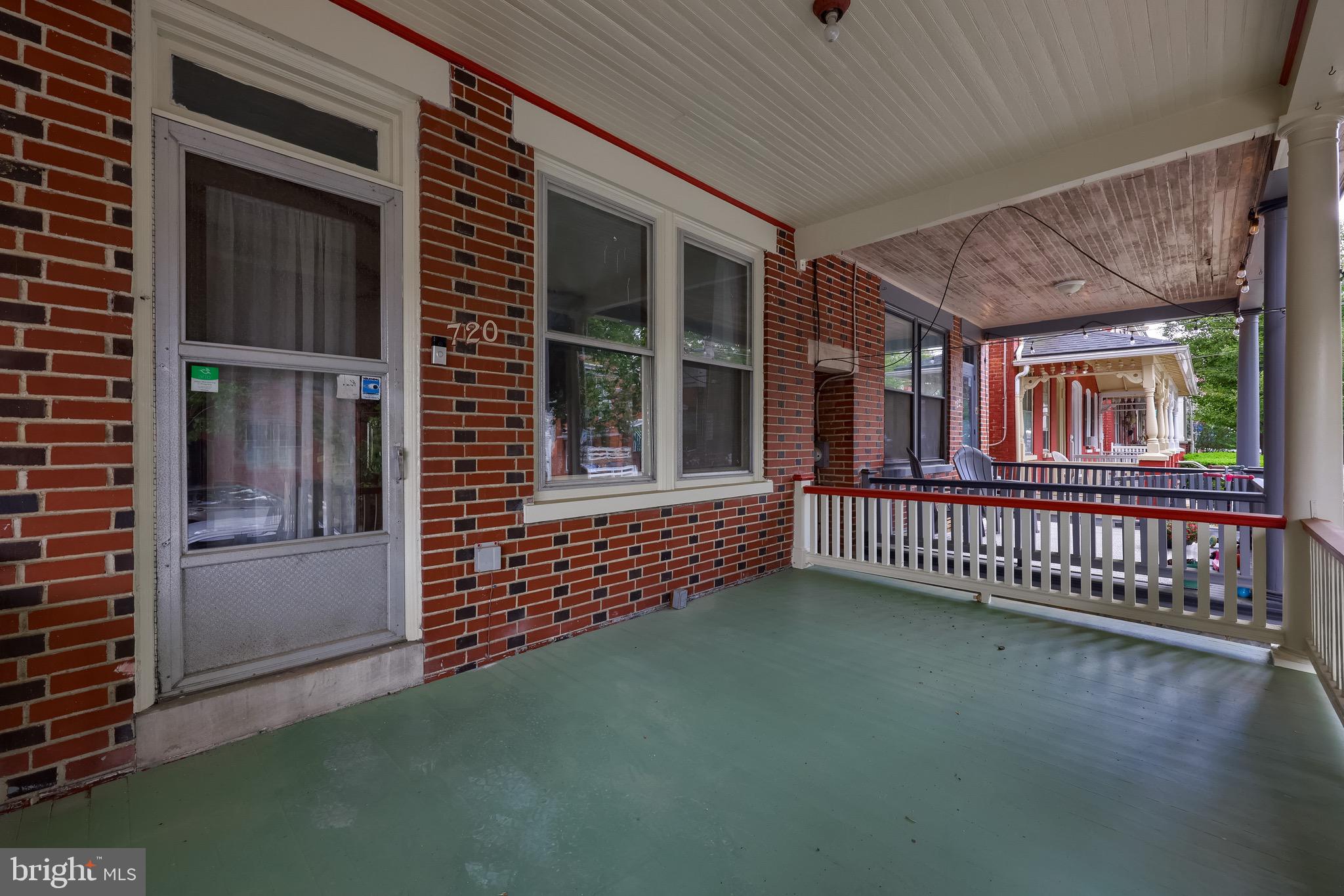 720 1st Street Lancaster, PA 17603 - Photo 8 of 50 a view of a porch with wooden floor and fence