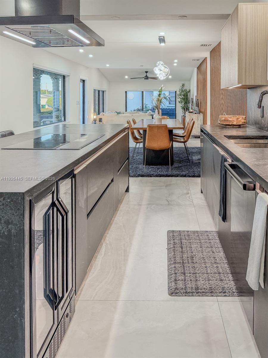 a kitchen with stainless steel appliances granite countertop a sink and stove