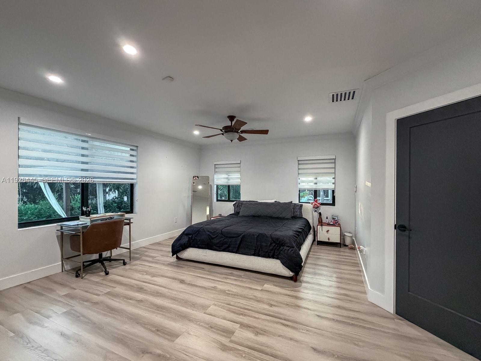 7840 Southwest 18th Terrace Miami, FL 33155 - Photo 11 of 28 a bedroom with furniture and a large window