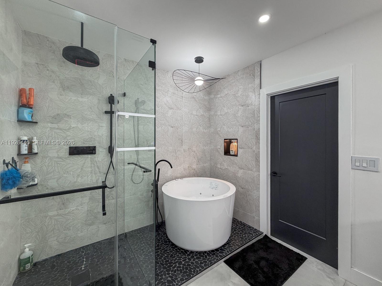 7840 Southwest 18th Terrace Miami, FL 33155 - Photo 13 of 28 a bathroom with a sink toilet and shower