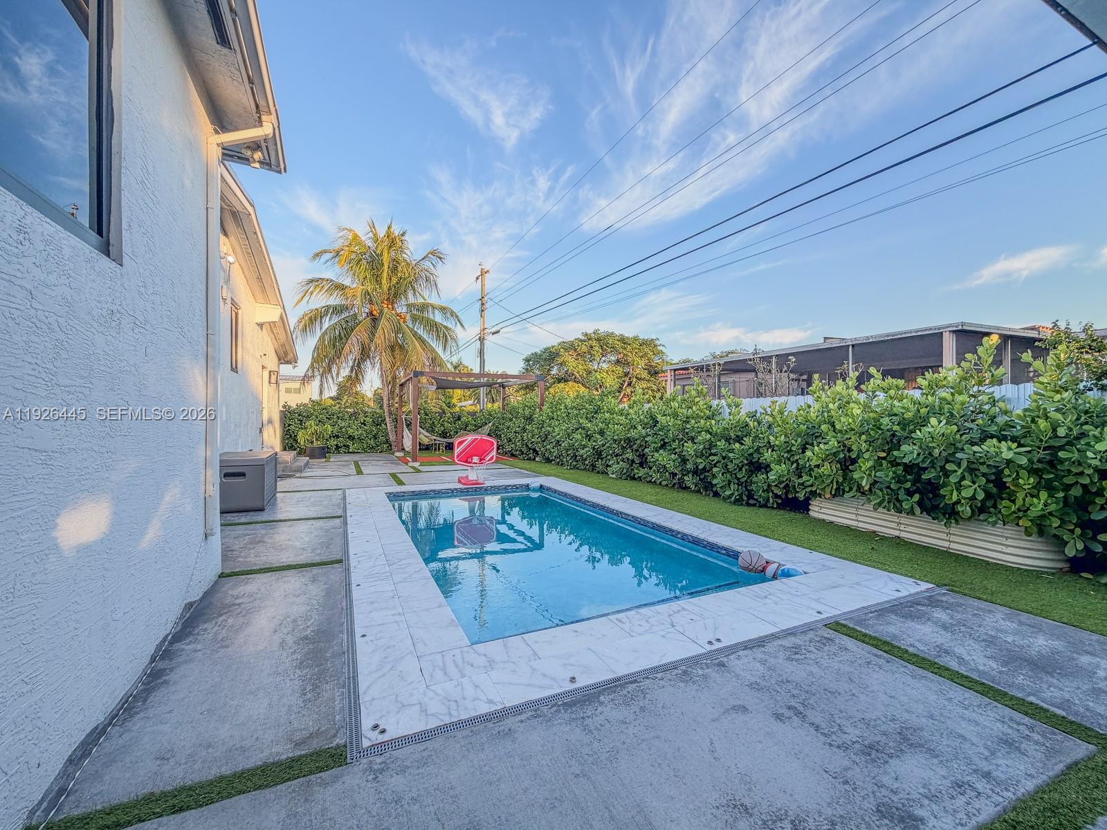 7840 Southwest 18th Terrace Miami, FL 33155 - Photo 21 of 28 a view of swimming pool with outdoor seating and plants