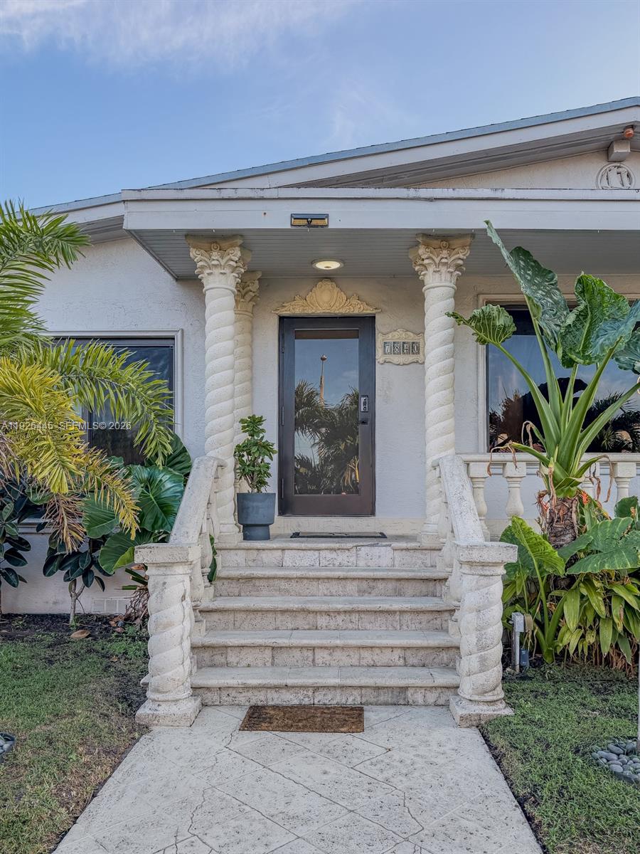 7840 Southwest 18th Terrace Miami, FL 33155 - Photo 22 of 28 a front view of a house with a yard