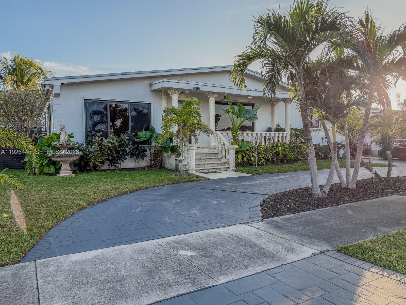7840 Southwest 18th Terrace Miami, FL 33155 - Photo 24 of 28 a front view of a house with garden and plants