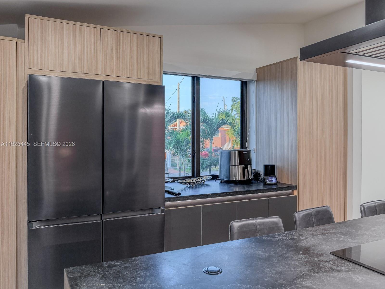 7840 Southwest 18th Terrace Miami, FL 33155 - Photo 4 of 28 a kitchen with refrigerator and window