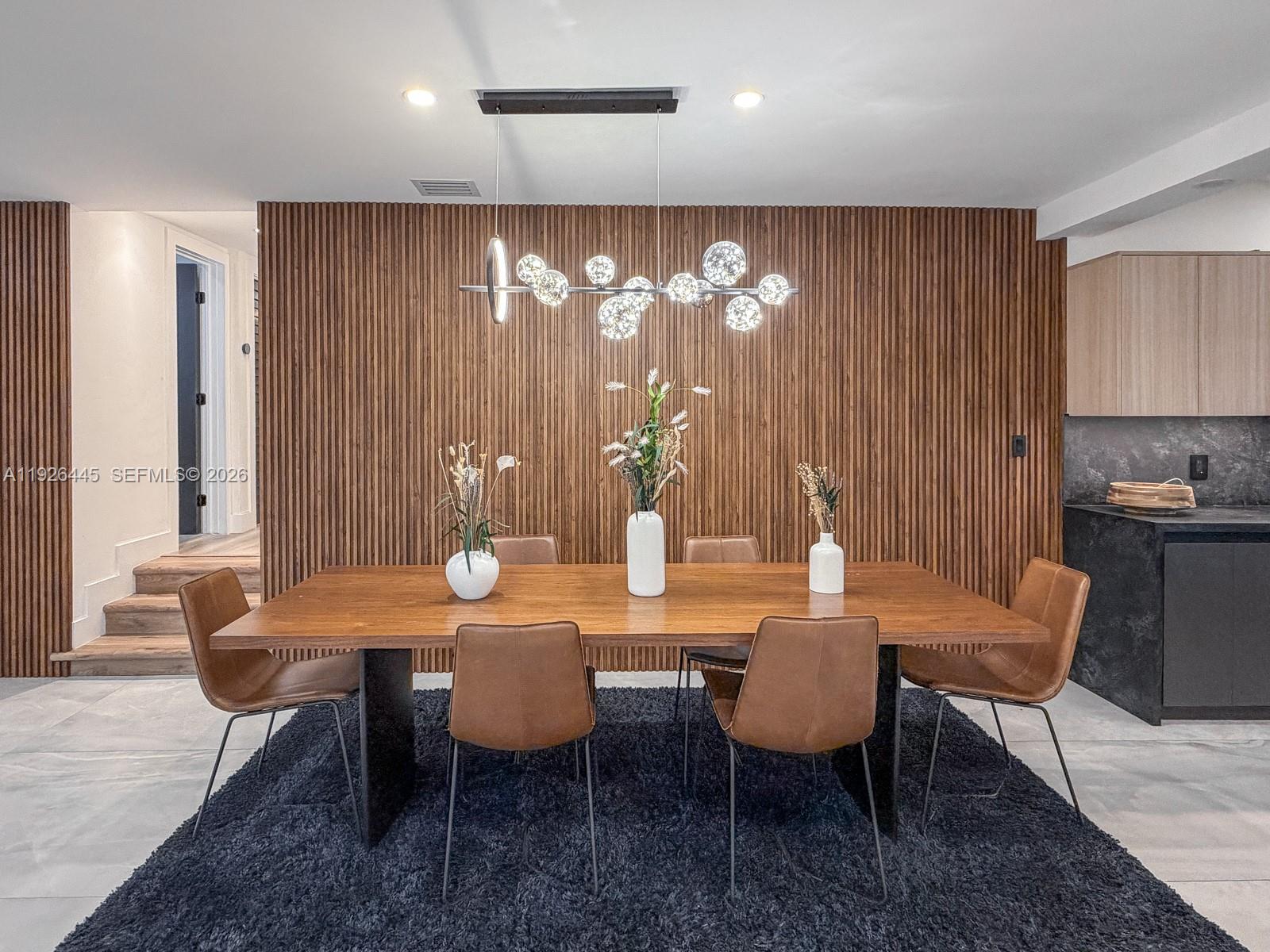 7840 Southwest 18th Terrace Miami, FL 33155 - Photo 5 of 28 a view of a dining room with furniture and chandelier