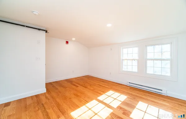 a view of an empty room with a window