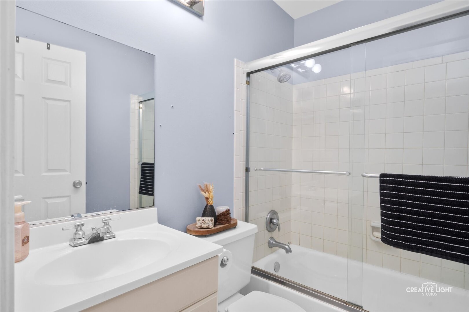 2437 Devonshire Court Aurora, IL 60502 - Photo 11 of 14 a bathroom with a sink toilet and shower