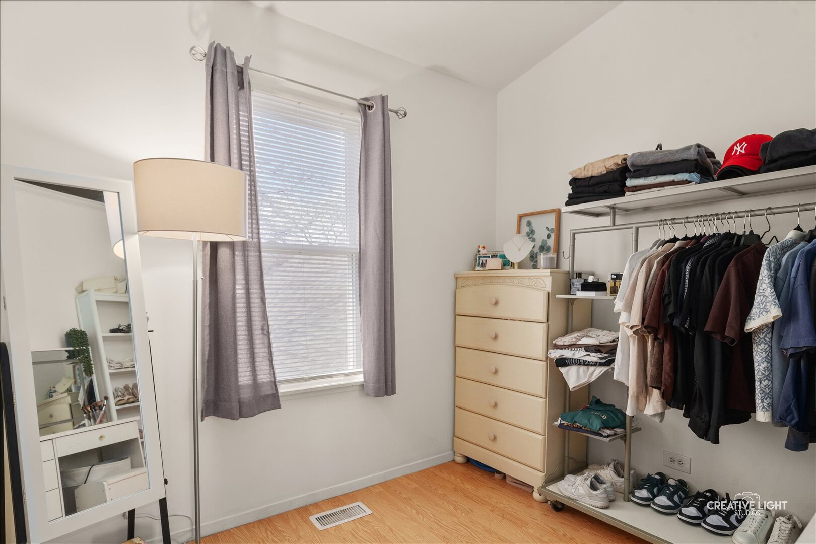 2437 Devonshire Court Aurora, IL 60502 - Photo 12 of 14 a view of walk in closet with clothes and shoes