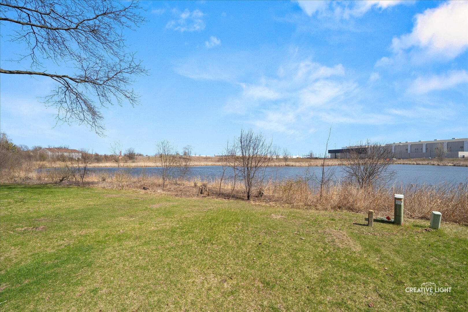 2437 Devonshire Court Aurora, IL 60502 - Photo 14 of 14 a view of a lake with houses in the back
