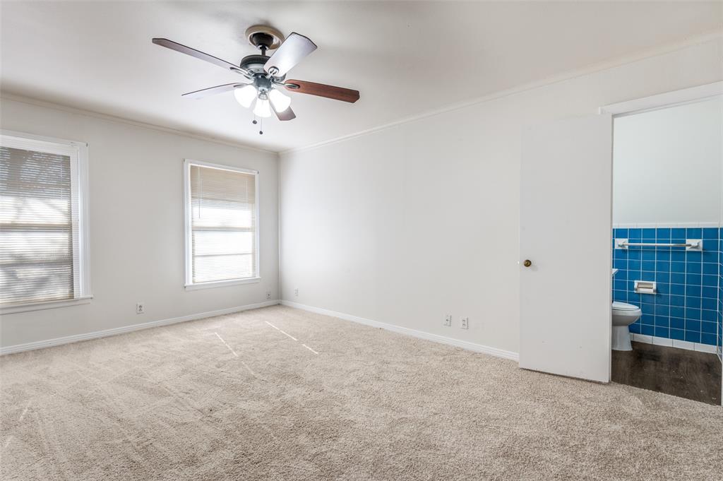 402 West Grauwyler Road Irving, TX 75061 - Photo 12 of 22 wooden floor in an empty room with a window