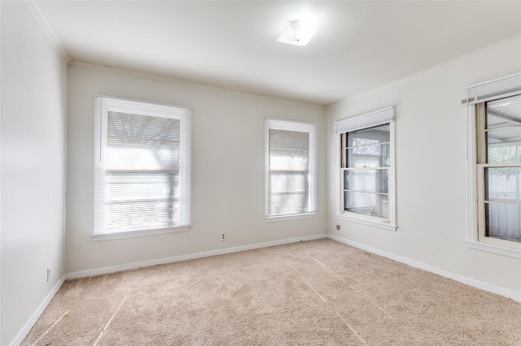 402 West Grauwyler Road Irving, TX 75061 - Photo 17 of 22 an empty room with windows
