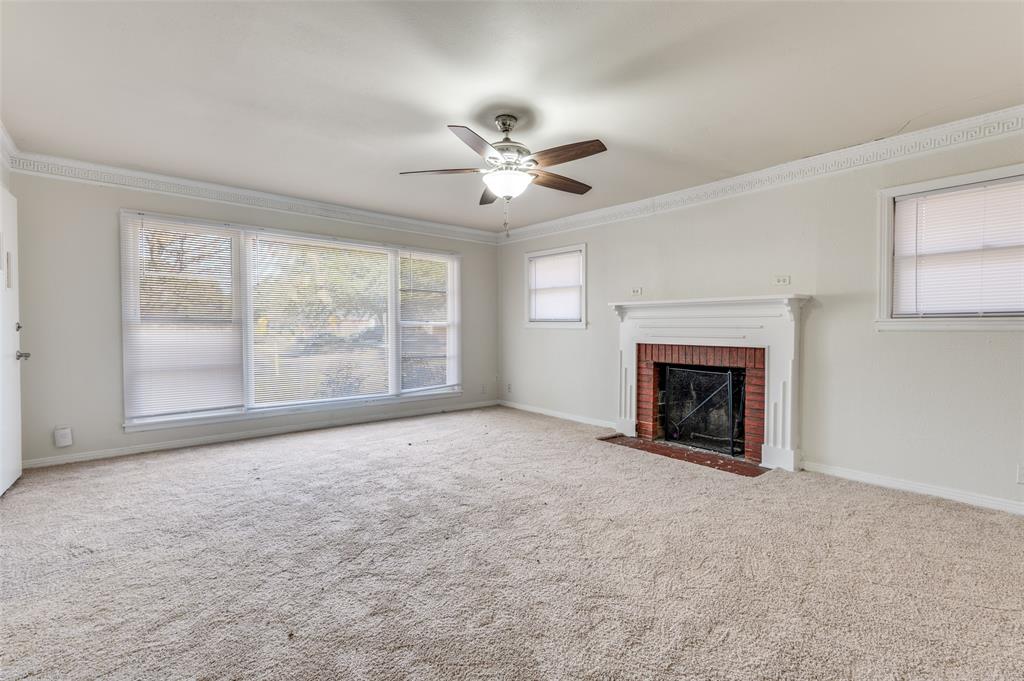 402 West Grauwyler Road Irving, TX 75061 - Photo 3 of 22 a view of empty room with fan and windows
