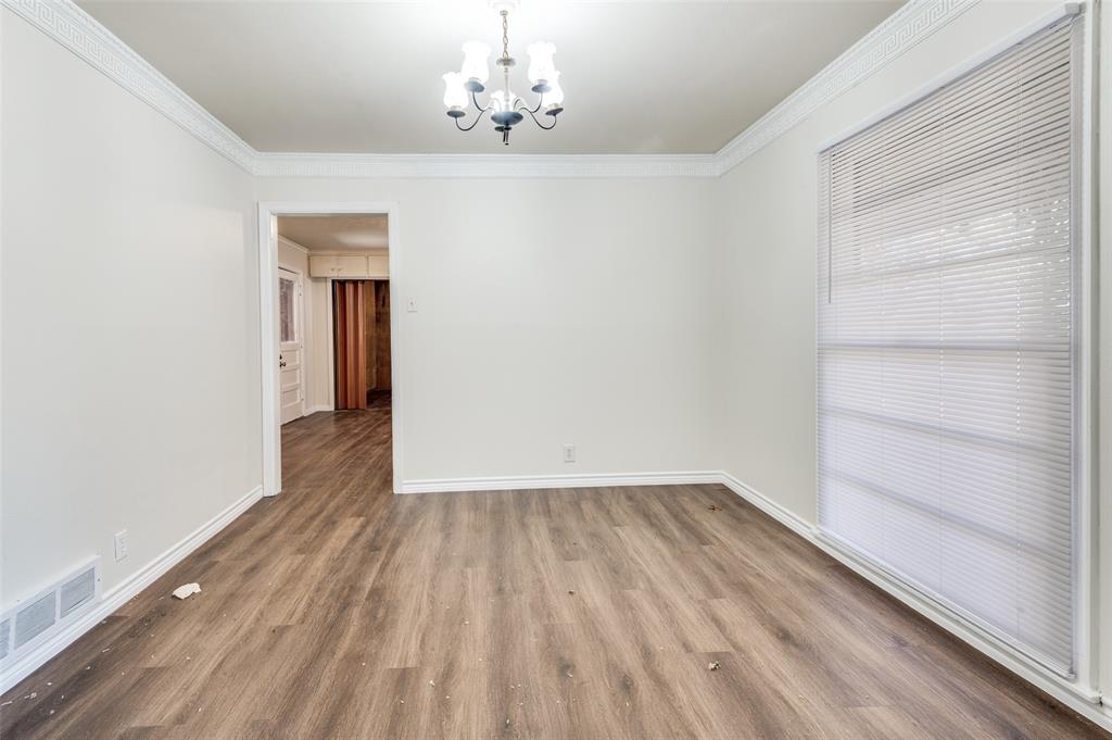 402 West Grauwyler Road Irving, TX 75061 - Photo 5 of 22 a view of a room with wooden floor and staircase