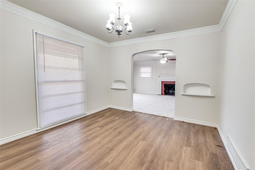 402 West Grauwyler Road Irving, TX 75061 - Photo 6 of 22 wooden floor in an empty room with a window
