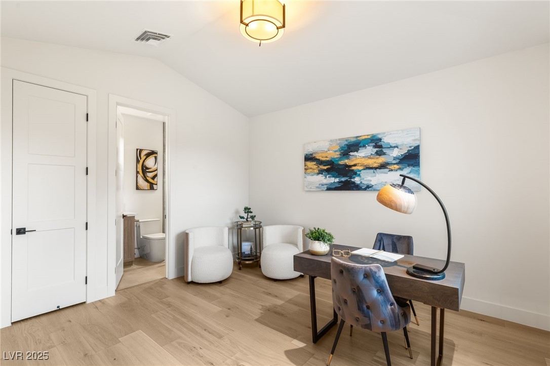 2316 Prometheus Court Henderson, NV 89074 - Photo 36 of 92 Office area featuring baseboards, light wood-style flooring, vaulted ceiling, and visible vents