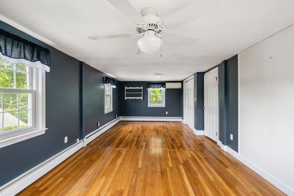 40 Bell Road Weymouth, MA 02188 - Photo 36 of 41 a view of an empty room with window and wooden floor