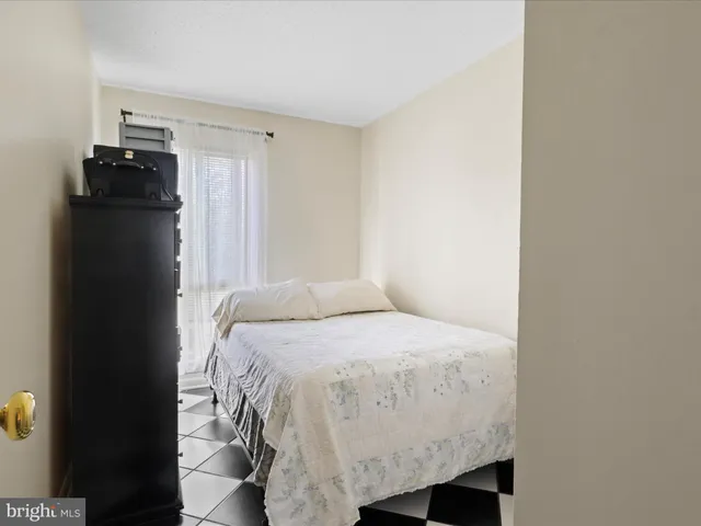 a bedroom with a bed and a closet