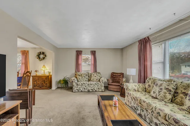 a bedroom with furniture and a flat screen tv
