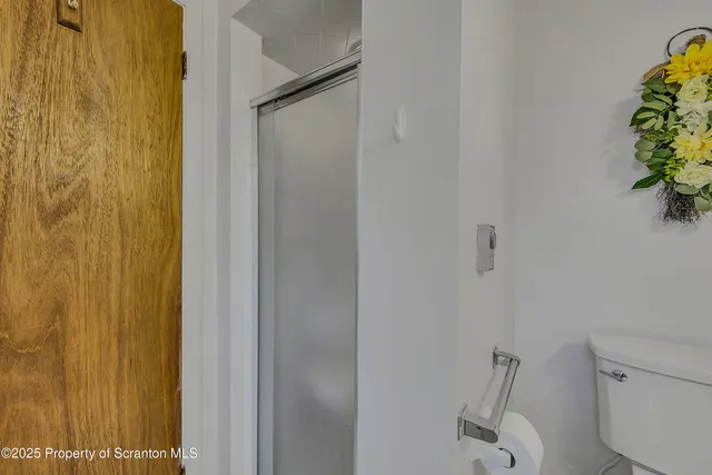 a bedroom with a bed and a dresser in it