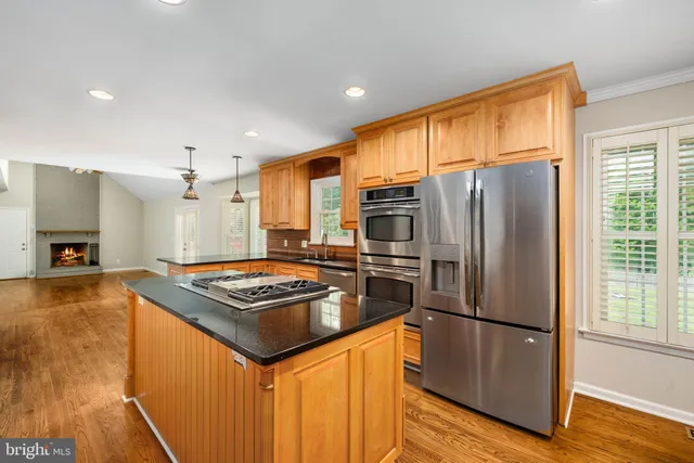 a view of a livingroom with a ceiling fan and window