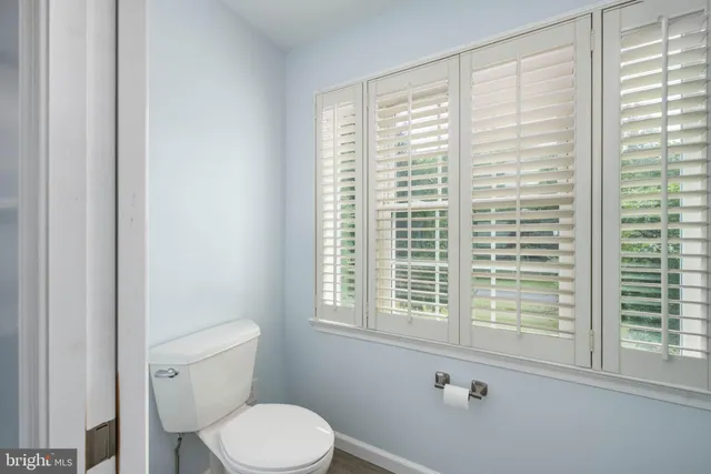 an aerial view of a house with a yard swimming pool and outdoor seating