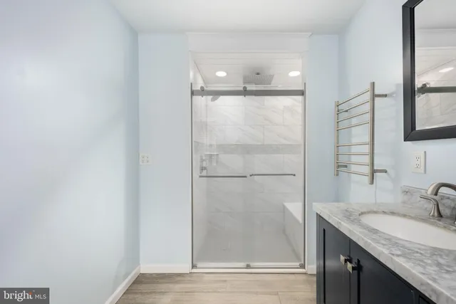 a view of a house with swimming pool and sitting area