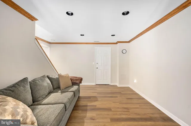 an aerial view of a house with a yard and outdoor seating