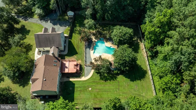 a backyard of a house with lots of green space