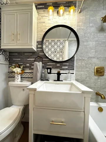 a utility room with a sink and a washer dryer