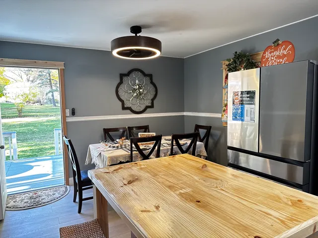 a view of a dining area with furniture and window