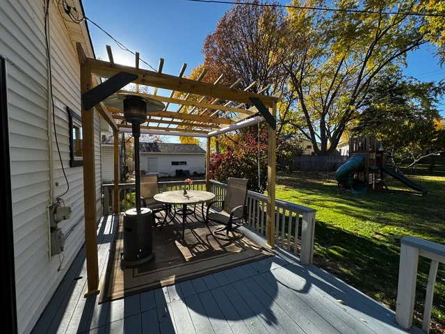 a view of a chairs and table in the balcony