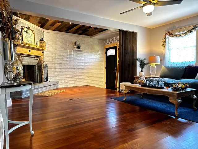 a living room with furniture and a fireplace