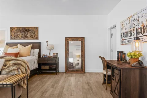 a bedroom with a bed and a couch