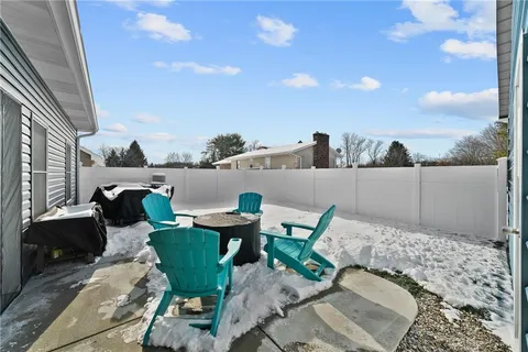 a front view of house with yard and sitting area