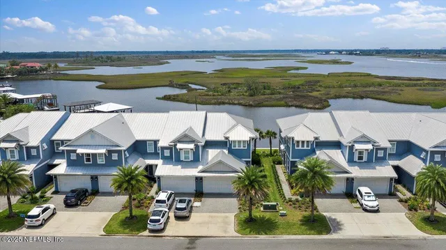 a view of a swimming pool and outside seating area